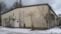 Metal framework provides support for climbing plants, which woul otherwise not find anchorage on the smooth metal wall surfaces (courtesy P Early)